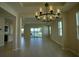 Open dining room with view of lake and modern light fixture at 1027 Ocean Spray Dr, Ruskin, FL 33570