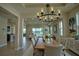Elegant dining room with modern chandelier, views and comfortable seating at 1027 Ocean Spray Dr, Ruskin, FL 33570