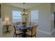 Bright dining area featuring modern lighting and neutral decor for a cozy atmosphere at 1027 Ocean Spray Dr, Ruskin, FL 33570