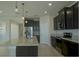 Modern kitchen features a large island with granite countertops and stainless steel appliances at 1027 Ocean Spray Dr, Ruskin, FL 33570