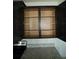 Open dark wood kitchen cabinets with light interiors and granite countertops, offering ample storage at 1027 Ocean Spray Dr, Ruskin, FL 33570