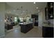 Modern open-concept kitchen with island, stainless steel appliances, and plenty of cabinet space at 1027 Ocean Spray Dr, Ruskin, FL 33570