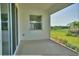 Covered lanai that looks out to a lush backyard at 1027 Ocean Spray Dr, Ruskin, FL 33570