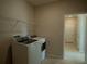 Laundry room featuring tile floors and a side-by-side washer and dryer at 1027 Ocean Spray Dr, Ruskin, FL 33570