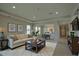 Bright living room with neutral tones, a modern sofa and stylish decor at 1027 Ocean Spray Dr, Ruskin, FL 33570