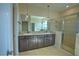 Main bathroom featuring double vanity, granite countertops, and glass shower at 1027 Ocean Spray Dr, Ruskin, FL 33570