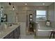Modern bathroom with glass shower, soaking tub, and elegant fixtures at 1027 Ocean Spray Dr, Ruskin, FL 33570