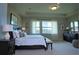 Elegantly staged bedroom with water views, plush bedding, and stylish furniture at 1027 Ocean Spray Dr, Ruskin, FL 33570