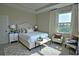 Tastefully designed primary bedroom featuring a tray ceiling and neutral decor at 1027 Ocean Spray Dr, Ruskin, FL 33570