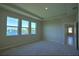 Bright main bedroom with three windows showing beautiful lake views at 1027 Ocean Spray Dr, Ruskin, FL 33570