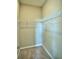 Empty walk-in closet with shelving and carpeted flooring at 1027 Ocean Spray Dr, Ruskin, FL 33570