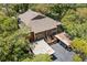 Birds eye view showing roof, siding, stairs to units, and covered parking at 104 Cypress Pond Rd, Palm Harbor, FL 34683
