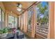 Relaxing balcony view featuring tiled floor, curtains and furniture to enjoy the outdoor scenery at 104 Cypress Pond Rd, Palm Harbor, FL 34683