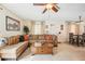 Living room with sectional sofa, coffee table, and view into dining area at 1301 New Bedford Dr # 1301, Sun City Center, FL 33573