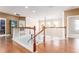 Upstairs hallway with hardwood floors and a view of the staircase at 1504 Ringmore Ct, Dover, FL 33527