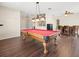 Game room featuring a pool table and a bar area at 17800 Souter Ln, Land O Lakes, FL 34638