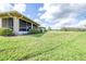 Expansive backyard with well-maintained lawn and partial view of home at 2104 Hembury Pl # 33, Sun City Center, FL 33573