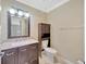 A granite vanity with updated fixtures is a focal point in this bathroom at 2104 Hembury Pl # 33, Sun City Center, FL 33573