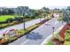 The entrance to the Kings Point community, lined with manicured landscaping and tall palm trees, offering an inviting welcome to visitors at 2104 Hembury Pl # 33, Sun City Center, FL 33573