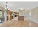 Open kitchen with stainless steel appliances, stone countertops and an island with seating at 2104 Hembury Pl # 33, Sun City Center, FL 33573