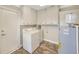 This laundry room provides a washer and dryer, plus a water heater at 2104 Hembury Pl # 33, Sun City Center, FL 33573