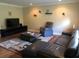 Comfortable living room with plush seating, TV, and decorative accents at 2104 Hembury Pl # 33, Sun City Center, FL 33573