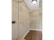 A walk-in closet with wood floors is equipped with wire rack shelving at 2104 Hembury Pl # 33, Sun City Center, FL 33573