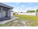 Fenced backyard with grassy area and patio at 3507 Chauncy Rd, Holiday, FL 34691