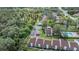 Aerial view showcasing community, pool, and lush landscaping at 3551 Magnolia Ridge Cir # 702, Palm Harbor, FL 34684