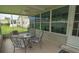 Covered porch with seating area and ceiling fan at 37449 Gill Ave, Zephyrhills, FL 33541
