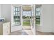 Front entry with view of neighborhood from windows at 37449 Gill Ave, Zephyrhills, FL 33541