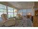 Sunroom with two comfy recliners and lots of natural light at 37449 Gill Ave, Zephyrhills, FL 33541