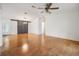 Spacious living area with hardwood floors and barn door at 37449 Gill Ave, Zephyrhills, FL 33541