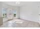 Sunroom with tile flooring and an ornate door at 37449 Gill Ave, Zephyrhills, FL 33541