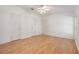Spacious bedroom with laminate wood flooring and multiple closets at 37449 Gill Ave, Zephyrhills, FL 33541