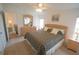 Main bedroom with a king-size bed and plenty of dresser space at 37449 Gill Ave, Zephyrhills, FL 33541
