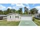 Single-Gathering home with a large driveway and well-maintained yard at 37449 Gill Ave, Zephyrhills, FL 33541