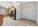 Kitchen with stainless steel refrigerator, wood cabinets, and tile floor at 37449 Gill Ave, Zephyrhills, FL 33541