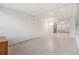 Common area with tiled floor and sliding glass doors to sunroom at 37449 Gill Ave, Zephyrhills, FL 33541