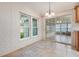 Bright dining area with access to a screened porch at 37449 Gill Ave, Zephyrhills, FL 33541