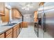 Kitchen with stainless steel appliances and wood cabinets at 37449 Gill Ave, Zephyrhills, FL 33541