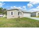 Single-story home with a two-car garage and well-manicured lawn at 37449 Gill Ave, Zephyrhills, FL 33541
