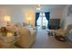 Bright living room featuring comfy sofas and a large TV at 37449 Gill Ave, Zephyrhills, FL 33541