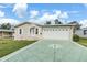 Charming single story home with a large garage and decorative driveway at 37449 Gill Ave, Zephyrhills, FL 33541