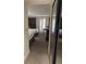 Bedroom with two twin beds, window with shutters, and mirrored closet at 4774 Fox Hunt Dr # C115 &C113, Wesley Chapel, FL 33543