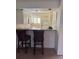 Efficient galley kitchen features granite countertops and breakfast bar at 4774 Fox Hunt Dr # C115 &C113, Wesley Chapel, FL 33543