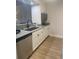 Updated kitchen with stainless steel appliances and gray countertops at 4774 Fox Hunt Dr # C115 &C113, Wesley Chapel, FL 33543