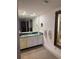 Bathroom boasts a large vanity with granite countertop at 4774 Fox Hunt Dr # C115 &C113, Wesley Chapel, FL 33543