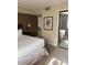 King-size bed and large mirror in this well-lit bedroom at 4774 Fox Hunt Dr # C115 &C113, Wesley Chapel, FL 33543