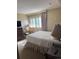 Bedroom with king-size bed and nightstand at 4774 Fox Hunt Dr # C115 &C113, Wesley Chapel, FL 33543